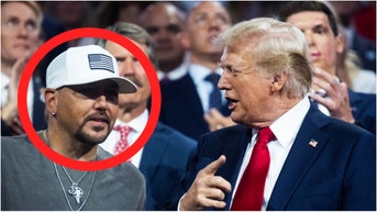 Country music star Jason Aldean says he'll sometimes randomly call and text President Donald Trump. Watch a video of his comments. (Tom Williams/CQ Roll Call via Getty Images)