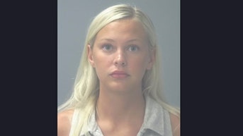 Laikyn Burklow's viral mugshot after arrest with Florida pharmacy owning parents