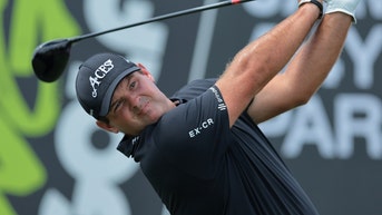 Patrick Reed hitting a driver