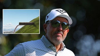 Phil Mickelson looking on