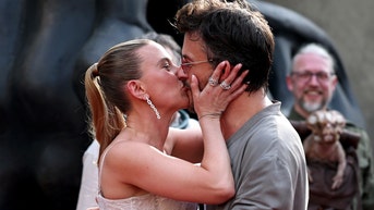 Scarlett Johansson her Jurassic World Rebirth co-star Jonathan Bailey kiss in front of Colin Jost