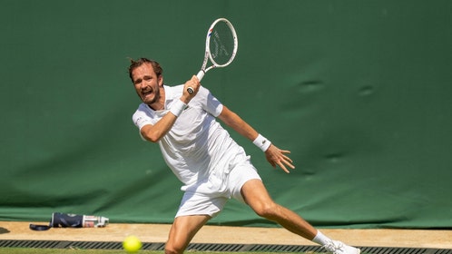 Daniil Medvedev hitting a forehand at Wimbledon