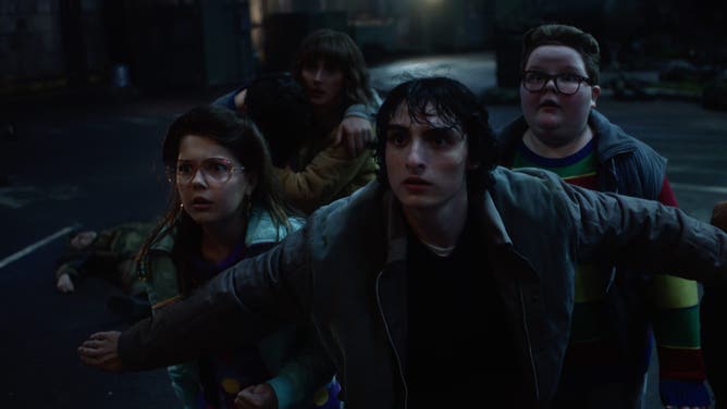 STRANGER THINGS. (L to R) Winona Ryder as Joyce Byers, Finn Wolfhard as Mike Wheeler and Jake Connelly as Derek in STRANGER THINGS. Cr. Courtesy of Netflix © 2025
