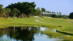 Golfer gets thrown into pond during fight.