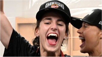 Caitlin Clark didn't seem impressed when a teammate started thrusting her from behind when celebrating winning the Commissioner's Cup. Watch a video of what happened. (Photo by David Dow/NBAE via Getty Images)