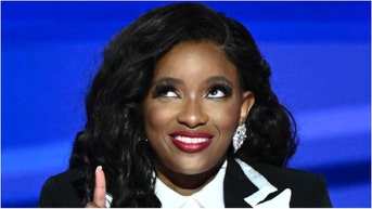 Jasmine Crockett's phone lock screen is apparently a photo of herself. Is it normal for someone's phone lock screen to be of themselves. (Photo by MANDEL NGAN/AFP via Getty Images)