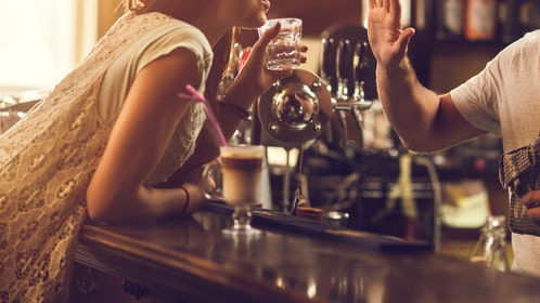 angry woman falls off bar stool in viral video