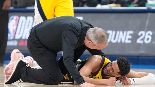 Tyrese Haliburton on floor after tearing his Achilles.