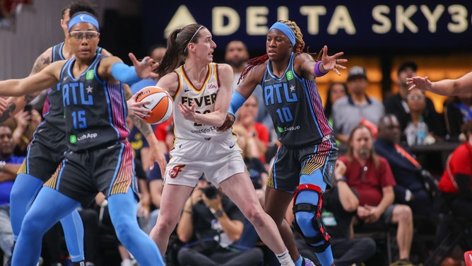 Indiana Fever's Caitlin Clark looks for an open teammate against the Atlanta Dream at State Farm Arena. (Photo Credit: Brett Davis-Imagn Images)