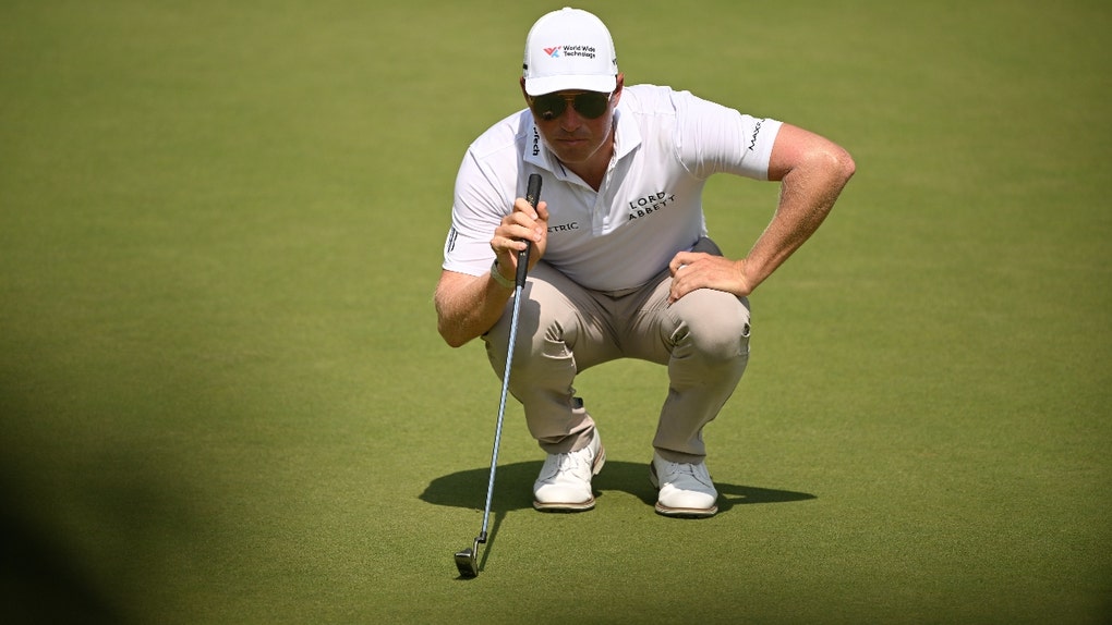 Ben Griffin reading a putt