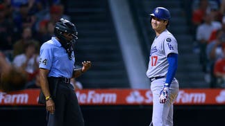 Shohei Ohtani of the Los Angeles Dodgers and umpire CB Bucknor
