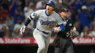 Shohei Ohtani running out of the batter's box.