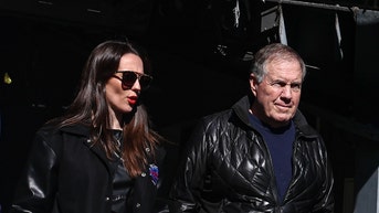 Bill Belichick walking with girlfriend Jordon Hudson