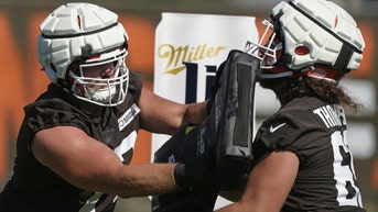Eagles offensive lineman Landon Dickerson shared some ice-cold Miller Lites with the Cleveland Browns after Thursday's practice.