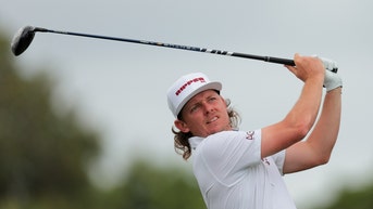 Cameron Smith hitting a driver in a LIV Golf event.