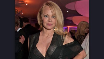 pamela anderson wears a trench coat and nothing else on dates