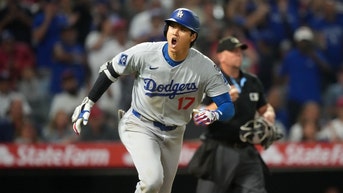 Shohei Ohtani running out of the batter's box.