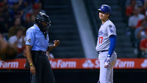Shohei Ohtani of the Los Angeles Dodgers and umpire CB Bucknor