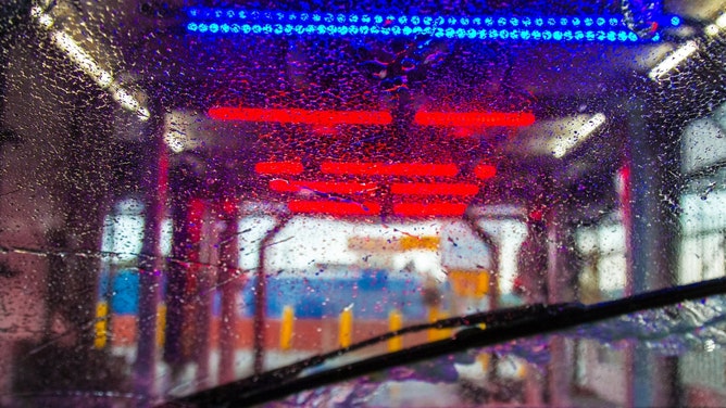 Horny Couple Gets Busted Getting Down & Dirty Near Gas Station's Car Wash