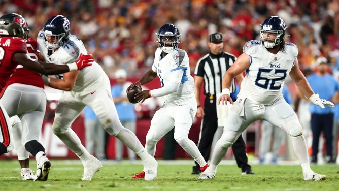 Tennessee Titans QB Cameron Ward drops back to pass vs. the Tampa Bay Buccaneers at Raymond James Stadium in NFL preseason Week 1 (Photo credit: Kevin Sabitus/Getty Images)
