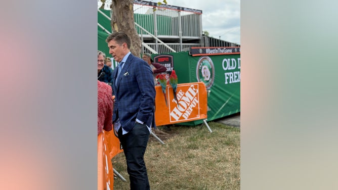 Reece Davis is surrounded by reporters, and parrots on Friday before the Texas vs. Ohio State game. 