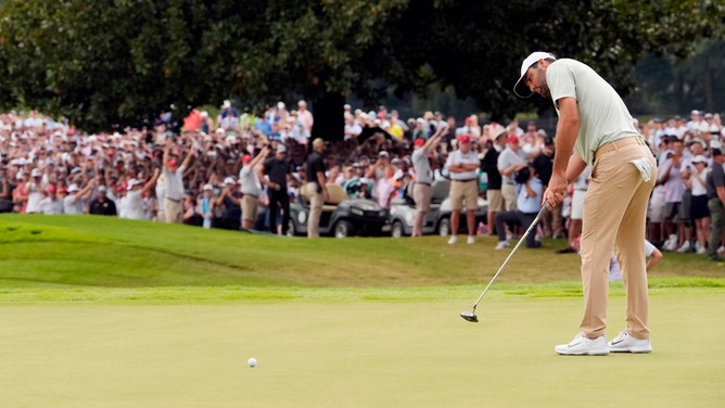 Scottie Scheffler putting on the final hole of the 2024 TOUR Championship at East Lake Golf Club in Atlanta, Georgia. (Photo credit: John David Mercer-Imagn Images)
