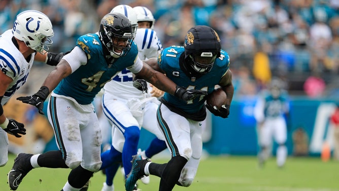 Jaguars DE Josh Hines-Allen scoops up a fumble forced by DE Travon Walker vs. the Indianapolis Colts at EverBank Stadium in Jacksonville, Florida. (Photo credit: Corey Perrine/Florida Times-Union)