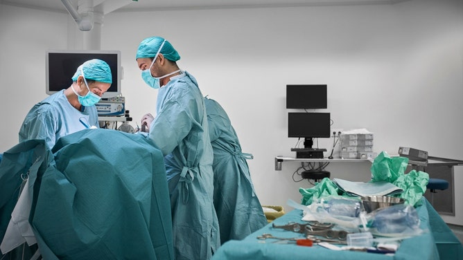 wife insecure about plastic surgeon husband's job performing boob jobs