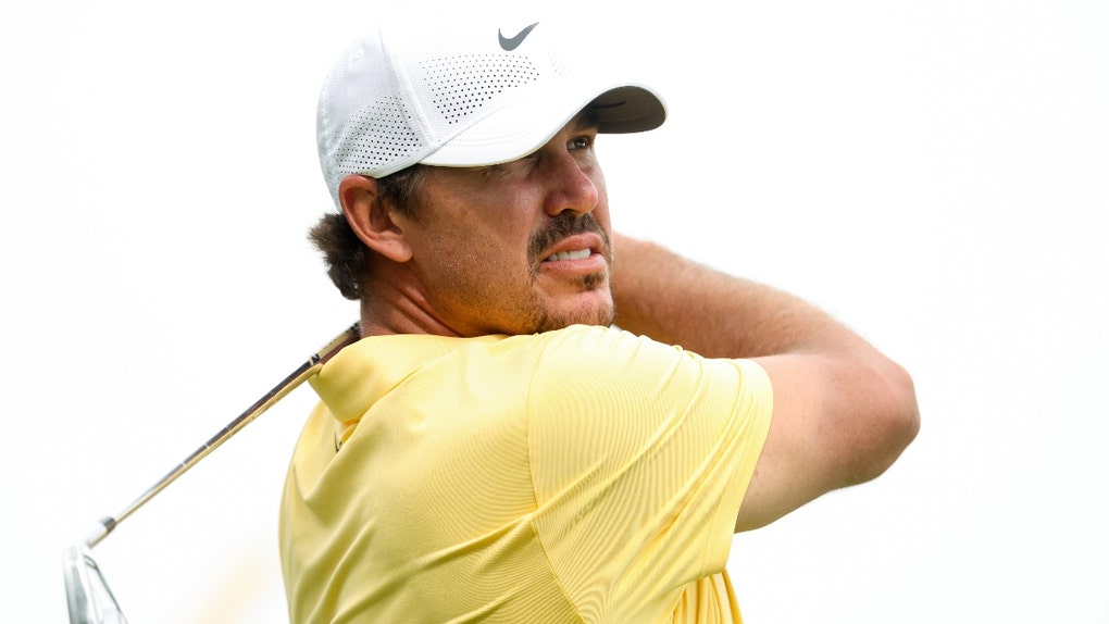 Brooks Koepka watches his shot
