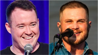 Comedian Shane Gillis linked up with Zach Bryan at his Notre Dame show, and the video footage is incredible. Watch the video. (Photo by Lorne Thomson/Redferns and Photo by Jeff Kravitz/FilmMagic for Clusterfest via Getty Images)