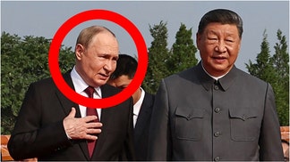 Russian leader Vladimir Putin and Chinese dictator Xi Jinping were caught on a hot mic talking about becoming immortal. Watch a video of their comments. (Photo by ALEXANDER KAZAKOV/POOL/AFP via Getty Images)