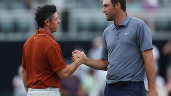 Rory McIlroy and Scottie Scheffler shaking hands