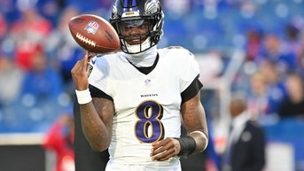 Lamar Jackson spinning a football on his finger in Buffalo