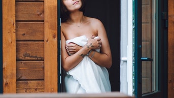 massage parlor owner arrested after answering door naked raised suspicions