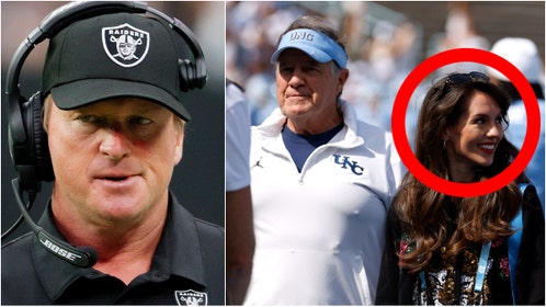 Jon Gruden sarcastically took a shot at the behavior of UNC coach Bill Belichick and his girlfriend Jordon Hudson. Watch a video of his comments. What did he say? (Photo by Ethan Miller/Getty Images and Photo by Lance King/Getty Images)
