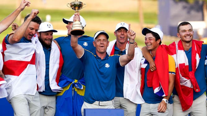 Luke Donald hoisting the Ryder Cup trophy in Italy