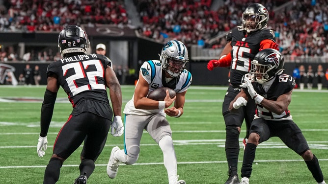 Carolina Panthers QB Bryce Young runs for a touchdown vs. the Atlanta Falcons at Mercedes-Benz Stadium. (Photo Credit: Dale Zanine-Imagn Images)