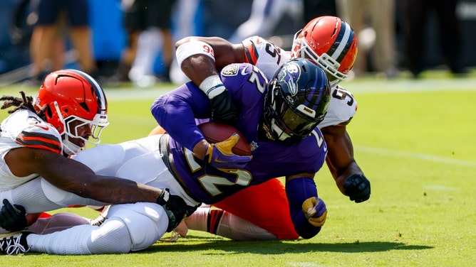 Cleveland Browns All-Pro Myles Garrett tackles Baltimore Ravens RB Derrick Henry at M&T Bank Stadium in Maryland. (Photo Credit: Peter Casey-Imagn Images)