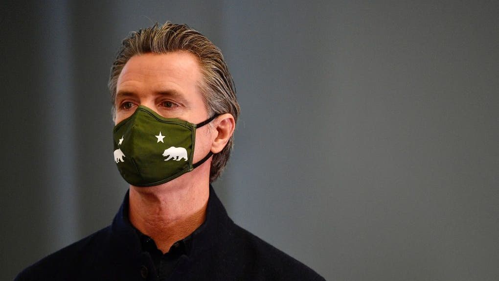 Gavin Newsom wearing a COVID mask