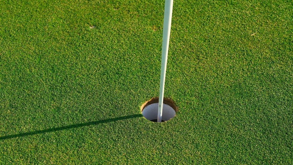 golf hole close up with pin