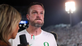 Oregon head coach Dan Lanning has the internet asking questions after revealing a massive tattoo of his wife on College GameDay. 