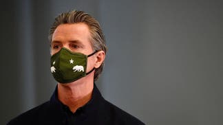 Gavin Newsom wearing a COVID mask