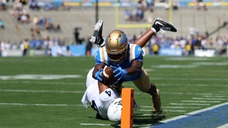 UCLA players and Penn State players