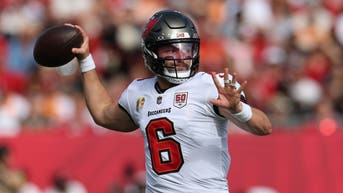 Tampa Bay Buccaneers QB Baker Mayfield attempts a pass against the San Francisco 49ers.