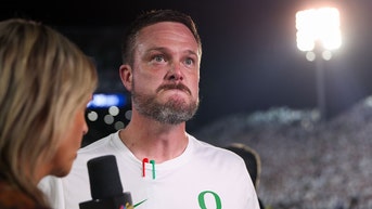 Oregon head coach Dan Lanning has the internet asking questions after revealing a massive tattoo of his wife on College GameDay. 