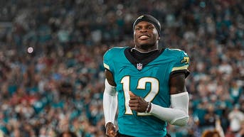 Jacksonville Jaguars rookie Travis Hunter smiling on the field