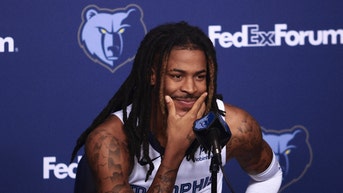 Ja Morant smiling during a press conference