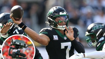 Justin Fields throwing a pass