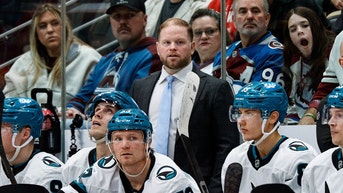 San Jose Sharks coach on the bench