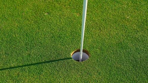 golf hole close up with pin